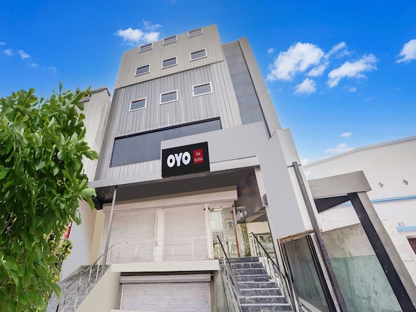 A hotel building with a sign reading 'OYO Hotel Star Divine'.