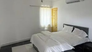 Habitación Deluxe | Sábanas de algodón egipcio, ropa de cama de alta calidad, caja fuerte