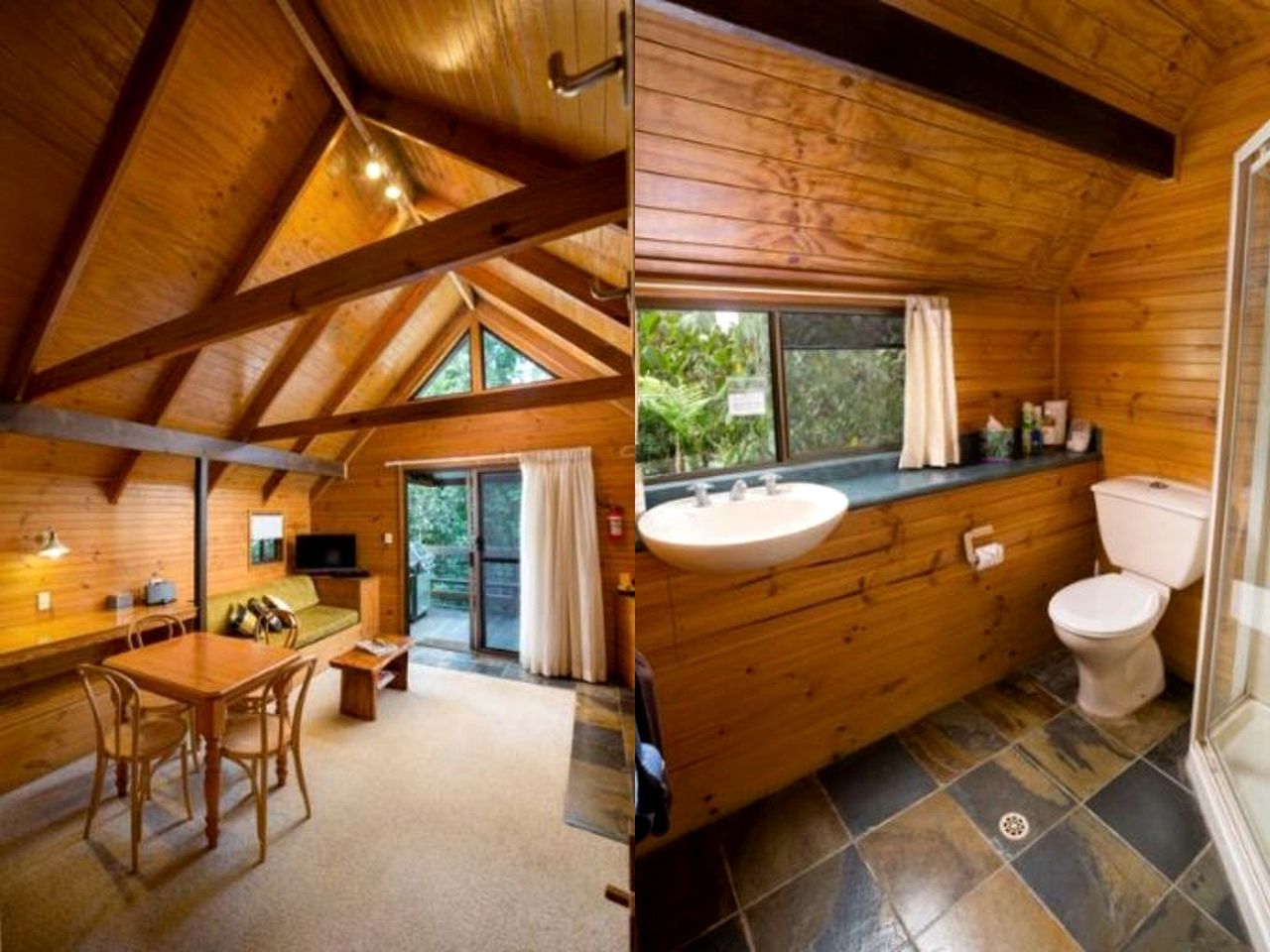 A wooden cabin interior with a dining area, a bathroom with a sink and toilet, and a view through a glass door.