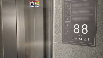 An elevator with a digital display showing the number 88 and the name 'James'.