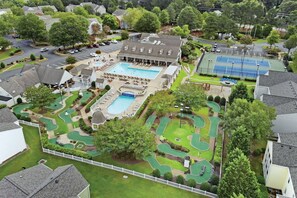 A residential property with a swimming pool, tennis court, and a golf course. - Williamsburg | Pool & Family Activities | 3BR Sleeps 10 (Williamsburg)