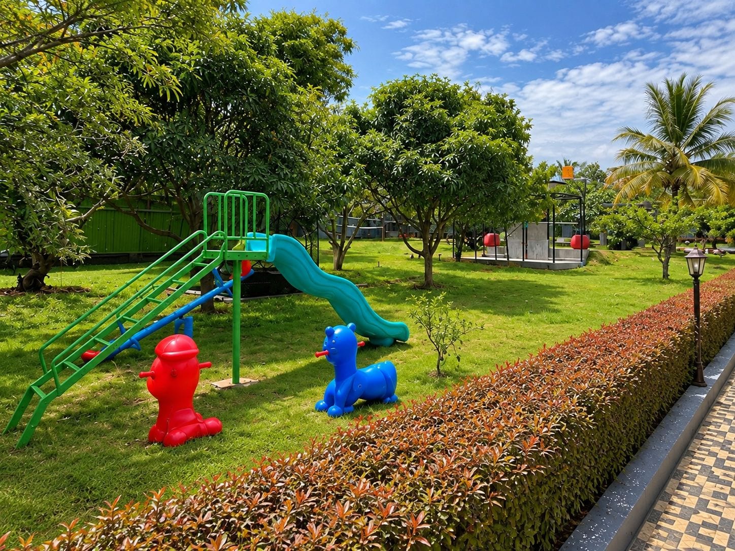 A playground with a slide and climbing structure, surrounded by well-maintained grass and hedges.