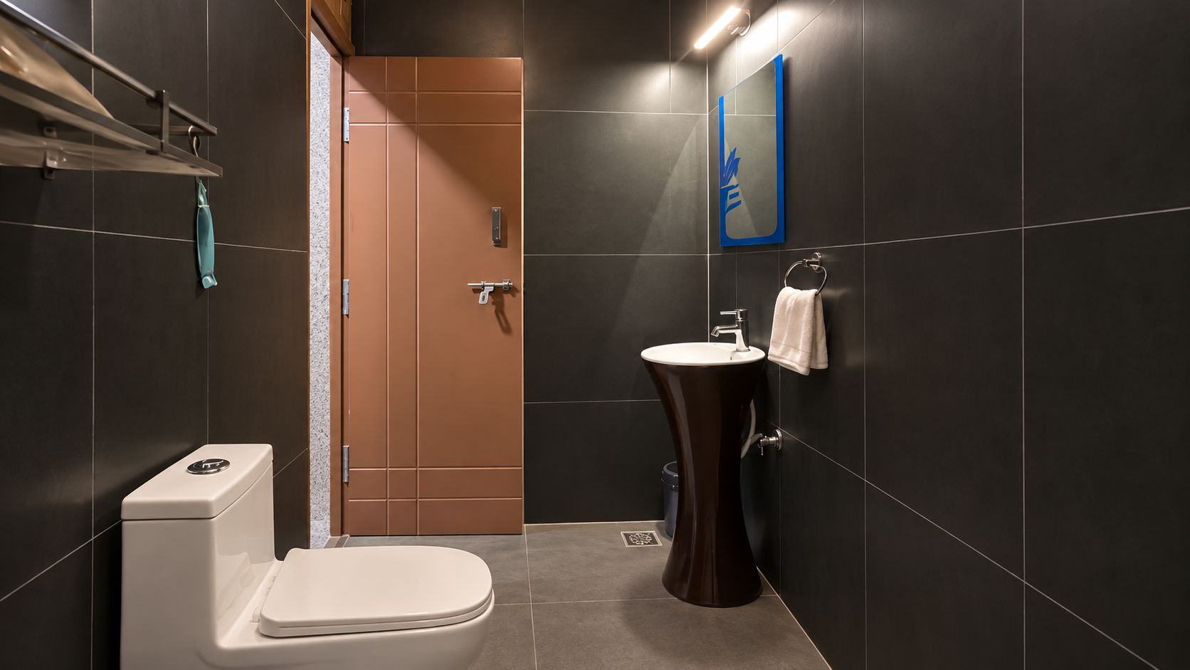 A modern bathroom with a toilet, sink, and shower.