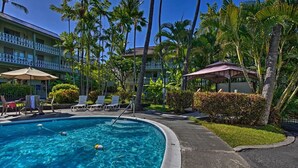 A swimming pool with lounge chairs and a no swimming sign. - AVAILABLE IRONMAN 2026 - OCEANVIEW Brilliant condo Close to the PIER For Ironman (Kailua-Kona)