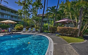 A swimming pool with lounge chairs and a no swimming sign. - AVAILABLE IRONMAN 2026 - OCEANVIEW Brilliant condo Close to the PIER For Ironman (Kailua-Kona)