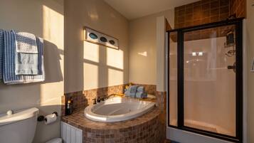 Jetted tub, hair dryer, towels, soap