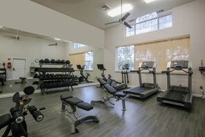 A gym with treadmills, weight machines, and dumbbells. - St. Augustine | Old Town Retreat | Pool & Historic Charm (St. Augustine)