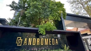 A modern building with a prominent sign reading 'ANDROMEDA' and a tall skyscraper in the background. - Andromeda Condominium Pattaya (Muang Pattaya)
