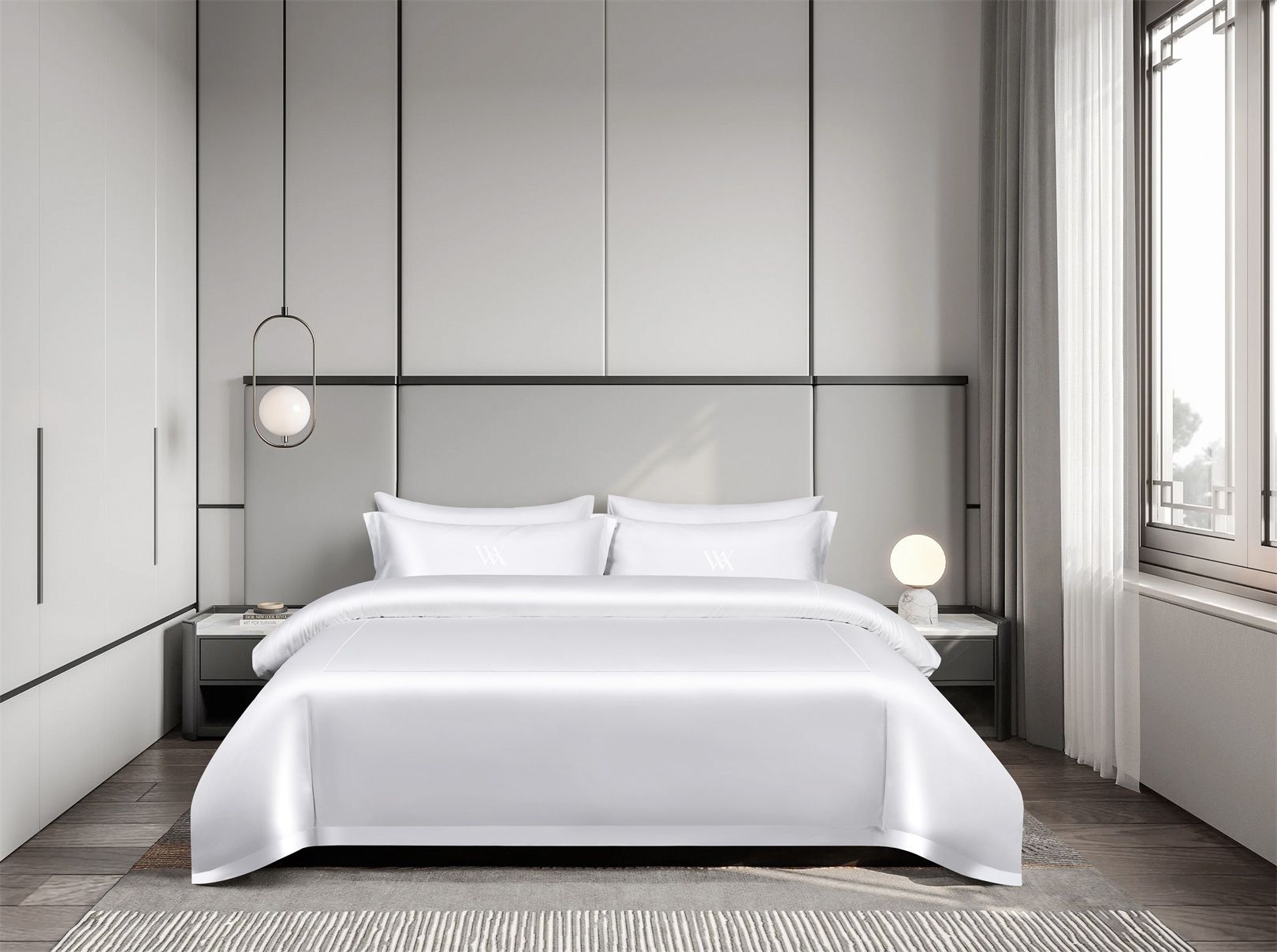 A modern bedroom with a large bed, a nightstand, a wall-mounted lamp, and a window with curtains.