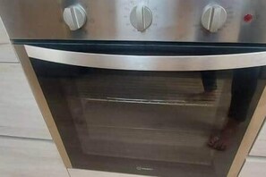An oven with a metallic finish and control knobs. - Townhouse with 3 suites and private pool (Tamarin)