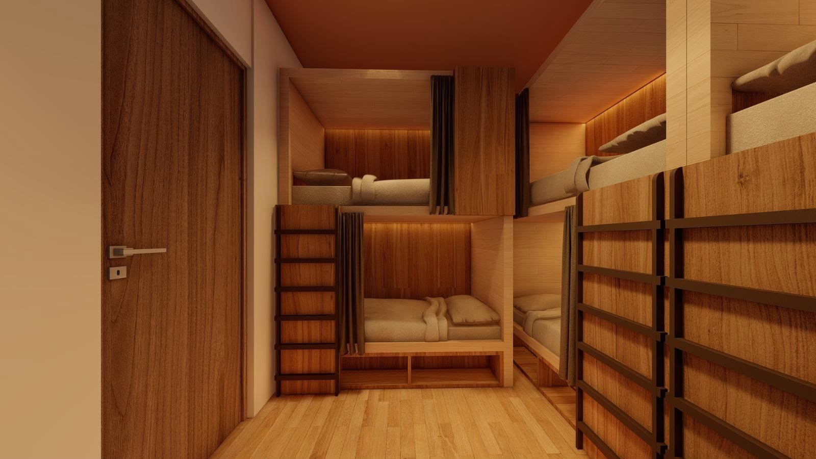 A compact room with bunk beds, a wooden wardrobe, and a door.