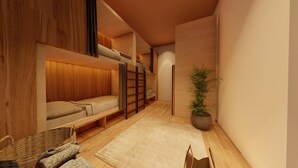 A room with a bunk bed, a small table, a potted plant, and a woven basket. - Atlas Hostel Sri Lanka (Negombo)