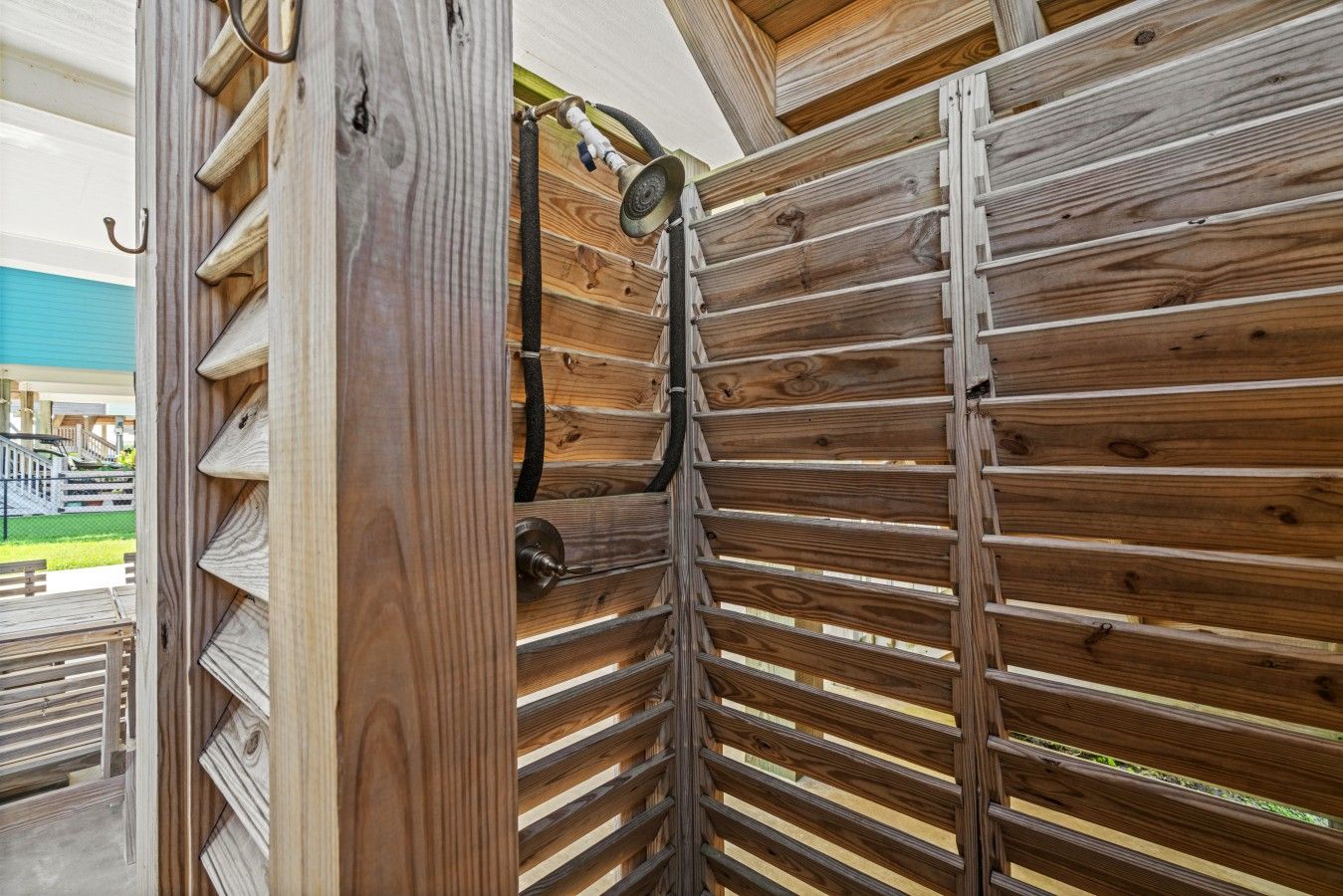 A wooden partition with a door and a window, part of a room's interior.