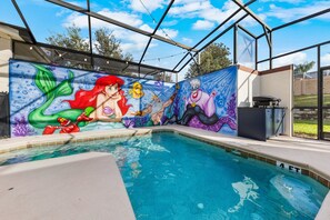 A swimming pool with a mural of mermaids and sea creatures on the walls. - 4BR Championsgate Themed Rooms & Private Pool (Davenport)