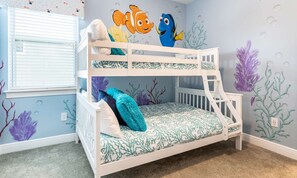 A bunk bed room with a marine-themed wall mural, including fish and coral. - 6BR Encore Villa Themed Rooms & Private Pool (Kissimmee)