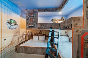 A bunk bed room with a ladder, a wall with a space-themed mural, and a ceiling with a mechanical design. - 5BR Bear's Den Theater, Pool & Spa (Kissimmee)