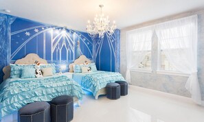 A bedroom with two beds, a chandelier, and a large window with sheer curtains. - 7BR Encore Villa With Epic Game Loft & Pool (Kissimmee)