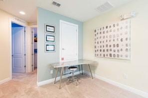 A room with a desk, a door, and a wall with a pattern. - Encore 7BR Villa, Pool, Near Disney (Kissimmee)