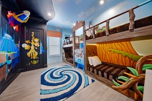 A children's room with bunk beds, a spiral rug, and wall art. - Deluxe Mansion With Swim up Bar and Pool Slide at Reunion (Kissimmee)