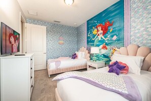 A bedroom with two beds, a dresser, a television, and a mural of a mermaid. - Exquisite Home w/ Games Room at Encore (Kissimmee)