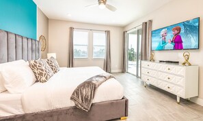 A bedroom with a bed, a TV, a dresser, and a window. - Marvelous Villa With Galactic Themed Bedroom at Encore (Kissimmee)