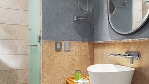 A bathroom with a white sink, a mirror, and a shower area. - Exclusive Grand Mayan 1BR Suite w/ Plunge Pool Oct 26 - Nov 2 Confirmed (Nuevo Nayarit)