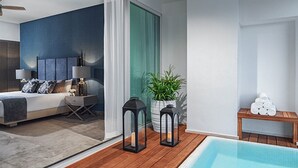 A modern bedroom with a large bed, bedside lamps, and a view of a swimming pool. - Exclusive Grand Mayan 1BR Suite w/ Plunge Pool Oct 26 - Nov 2 Confirmed (Nuevo Nayarit)