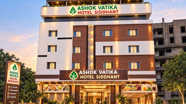 A multi-story hotel with a prominent sign reading 'Ashok Vatika Hotel Siddhant.' - Ashok Vatika Hotel Siddhant (Indore)