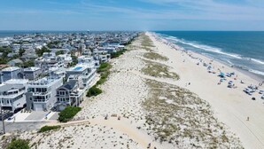 A coastal residential area with beachfront properties and a sandy beach. - Welcome to an extraordinary OCEANFRONT oasis in the heart of N Beach Haven LBI!! (Long Beach)