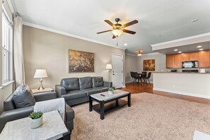 Open-concept living with fireplace, dining area, and bright kitchen - perfect for relaxing or entertaining. - South Reno 1BR Near Reno Events, Pool, Hot Tub, & Gym (Reno)
