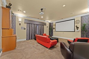 Catch a movie or binge your favorite series in the community theater room — a fun bonus for relaxing nights in. - South Reno 1BR Near Reno Events, Pool, Hot Tub, & Gym (Reno)