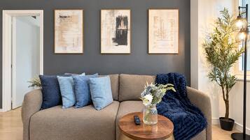 Deluxe Suite, Multiple Beds, Non Smoking, Private Bathroom | Living area | 48-inch TV with digital channels