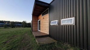 House exterior and entrance deck at dusk