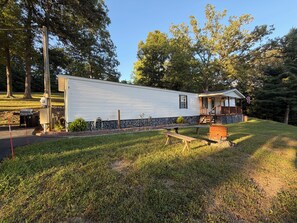 A mobile home with a porch, a picnic table, and a small shed. - Luxury Mountain Retreat ~ Ride-In/Ride-Out ATV/UTV Access (Rock)