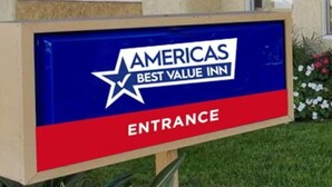 A sign for the Americas Best Value Inn with an entrance label. - Welcoming 1-bedroom/2 Double Bed Americas Best in Holly Springs (Holly Springs)