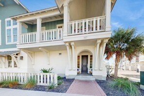 A two-story residential building with a balcony, a front door, and a number '197' on the facade. - Palmilla Beach Resort-197 Sunset Avenue (Port Aransas)