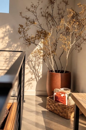Sunlit corner with throws and dried branches - Moasis · Pool, Hot Tub, Conversation Pit, Hammocks (Yucca Valley)