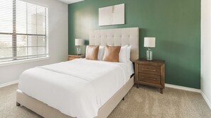A bedroom with a bed, nightstands, a lamp, and a window with blinds. - Landing | Stylish 2BD, Clubhouse, Gym (Katy)