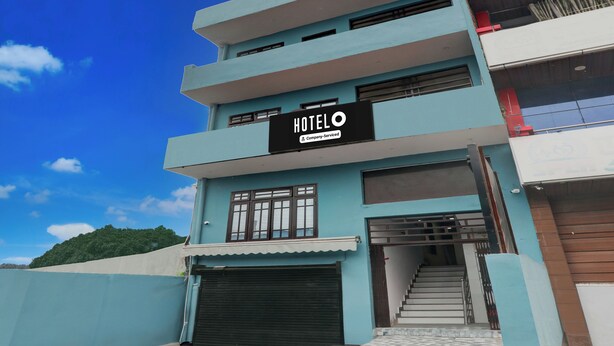 A multi-story hotel with a sign reading 'HOTEL' and 'Company Serviced.' - Hotel O Shri Buddheshwar Temple Lucknow (Lucknow)