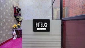 A hotel reception area with a sign indicating it is serviced by OYO. - Hotel O Gurdev Metro Station Kanpur (Kanpur)