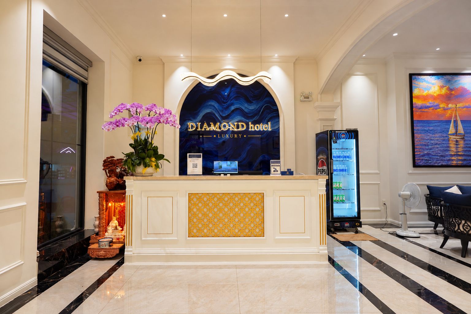 A reception desk with a sign reading 'DIAMOND hotel LUXURY'.