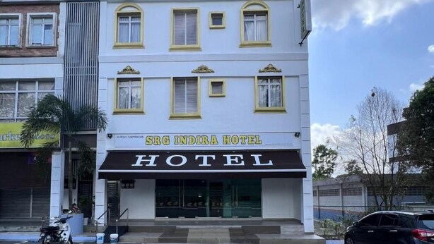 A hotel building with a sign that reads 'SRG INDIRA HOTEL.' - SRG Indira Hotel (Gelang Patah)