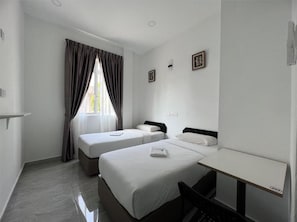 Habitación con 2 camas individuales, vistas a la ciudad | Wifi gratis