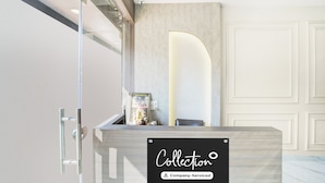 A reception desk with a sign reading 'Collection Company-Serviced'. - Collection O Ujjain City Centre (Ujjain)