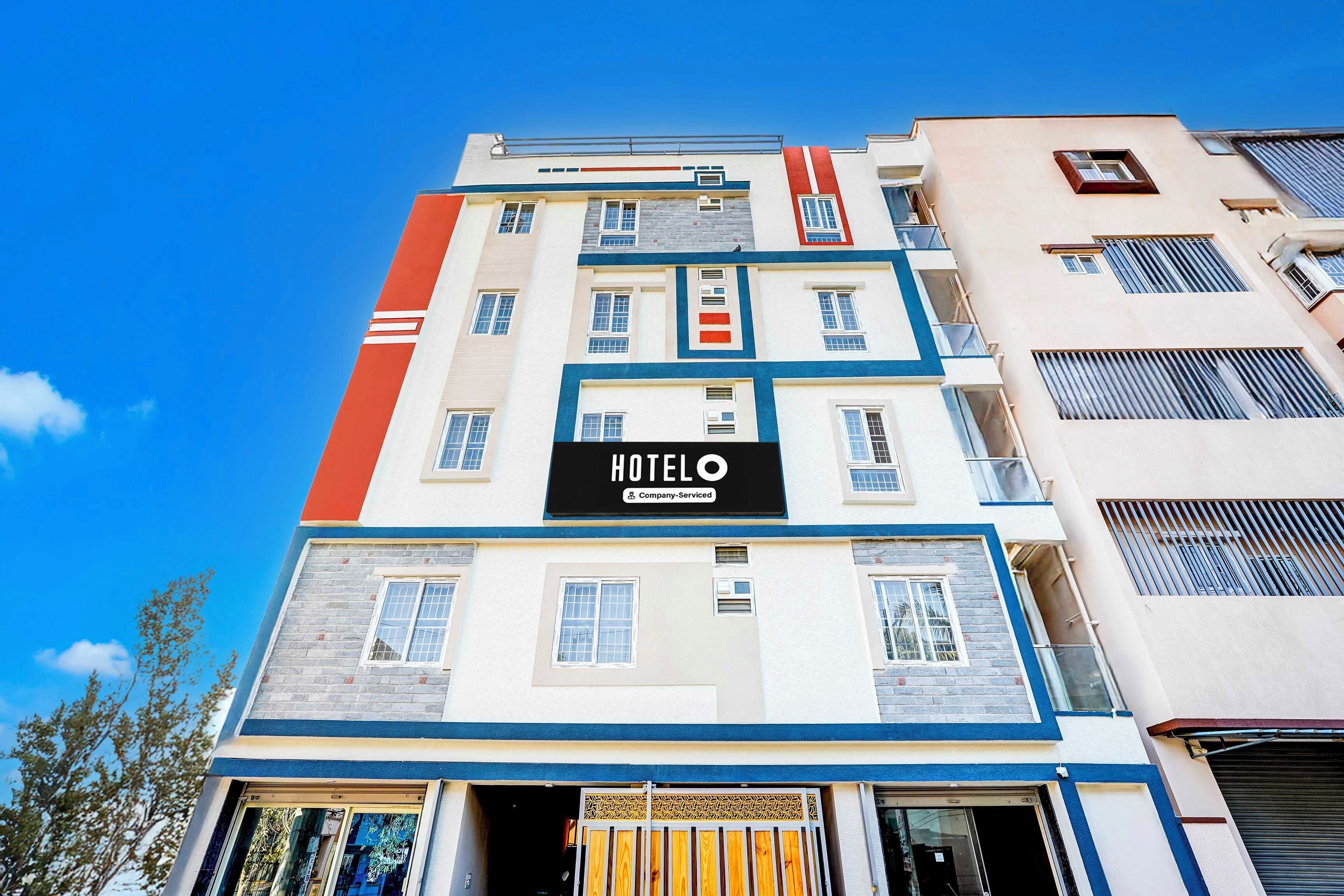 A multi-story hotel building with a prominent 'HOTEL' sign on the facade.