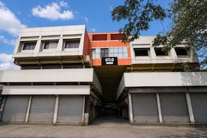 A multi-story building with a prominent 'HOTEL' sign. - Hotel O Nashik Road Railway Station (Nashik)