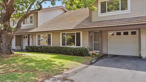 A two-story residential building with a garage, a covered front porch, and a well-maintained lawn. - Sea Bird & Pool Near the Beach and Track (Solana Beach)