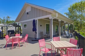 A covered patio with outdoor furniture, a grill, and a pergola. - 14 Mi to DuPont State Forest! Home w/ Pool Access (Flat Rock)