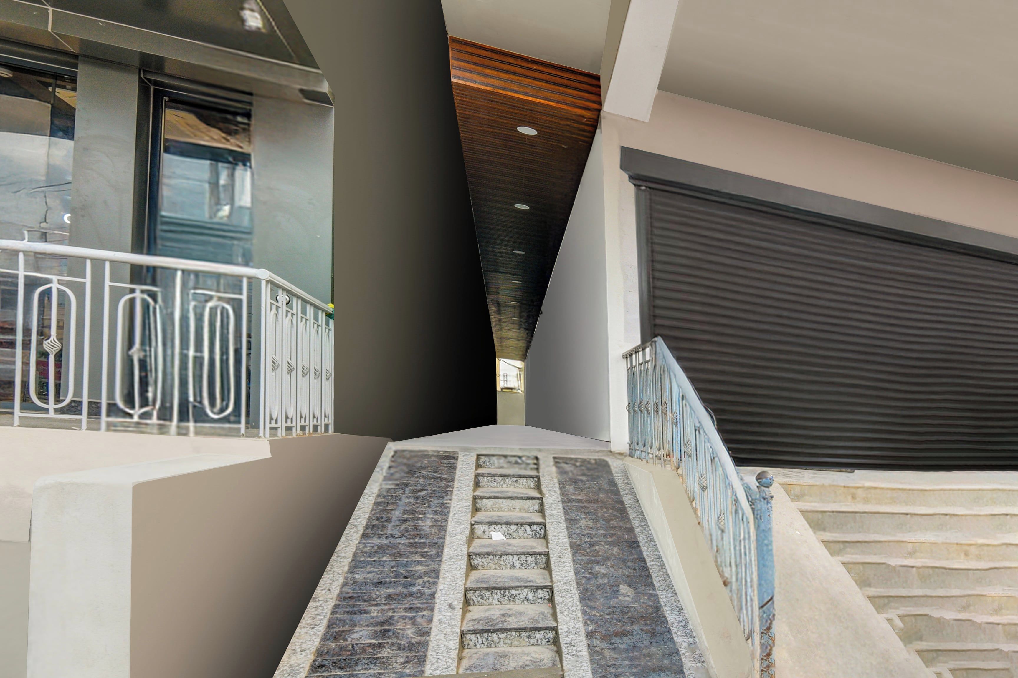 A staircase with metal railings leading to a building entrance.