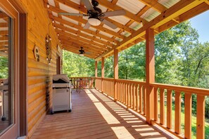 A wooden deck with a ceiling fan, a grill, and a view of a forest. - 4 Mi to Cherokee Lake! Wooded Escape Near Hiking (Murphy)